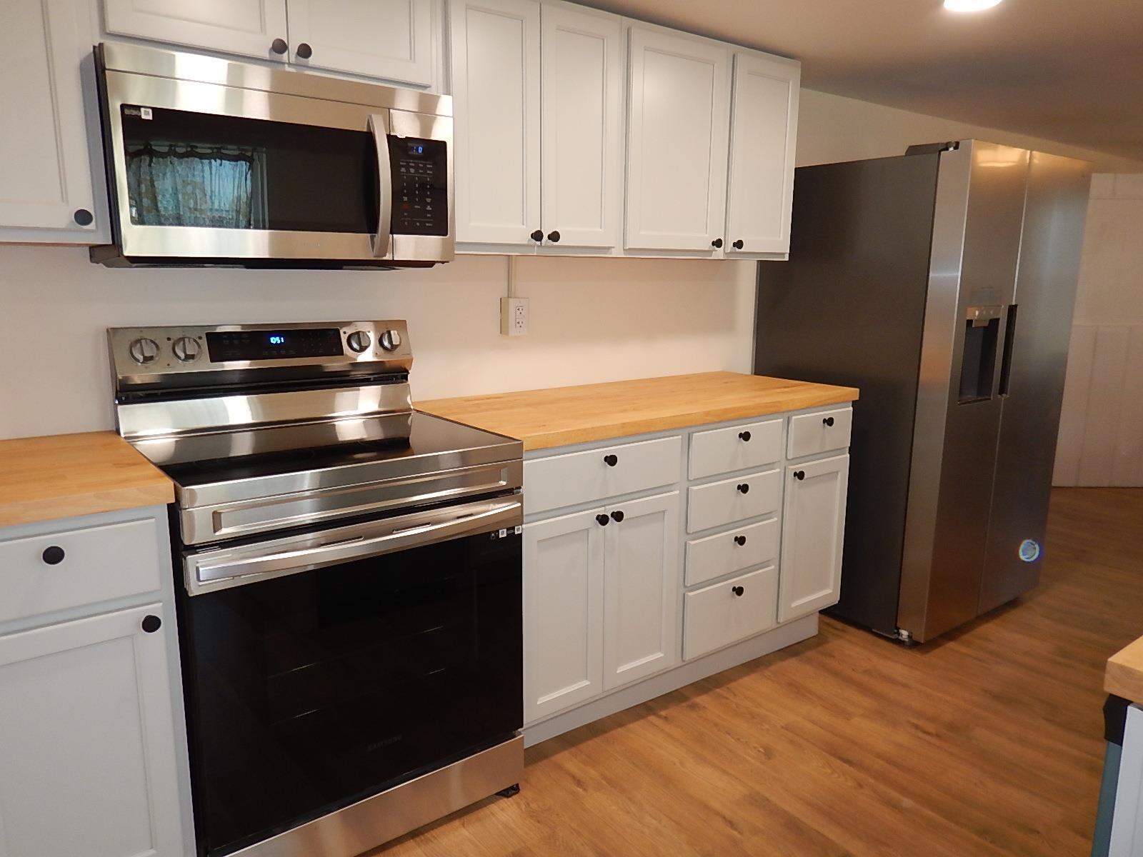 3653 Middlebrook Village Road Middlebrook, VA 24459 - Photo 19 of 48 a kitchen with stainless steel appliances and wooden cabinets