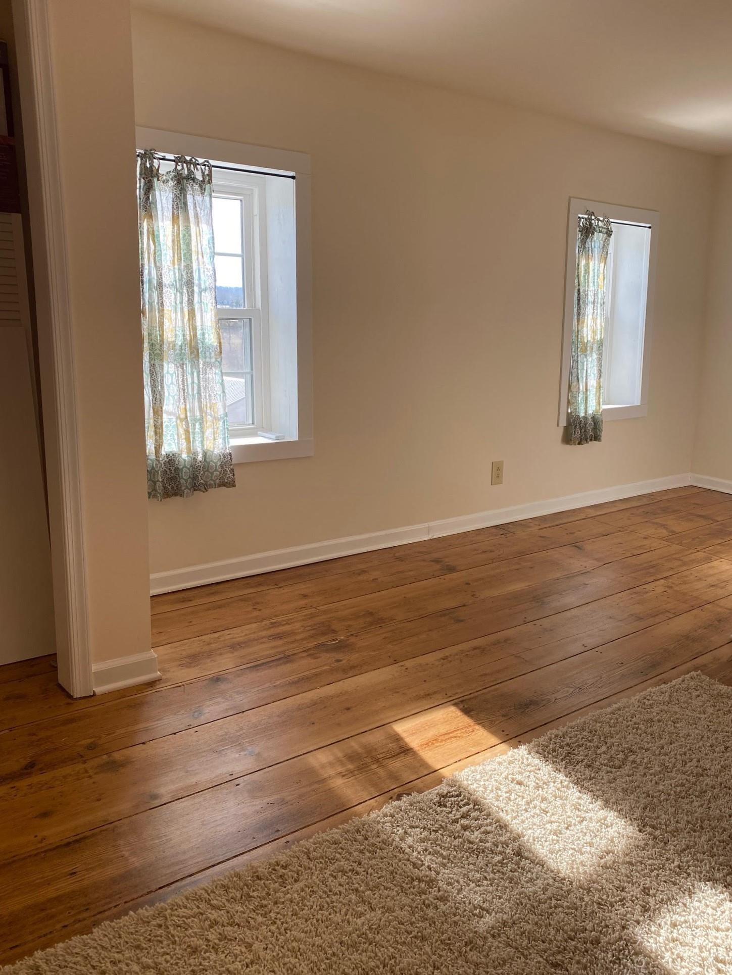 3653 Middlebrook Village Road Middlebrook, VA 24459 - Photo 26 of 48 a view of an empty room with wooden floor and a window