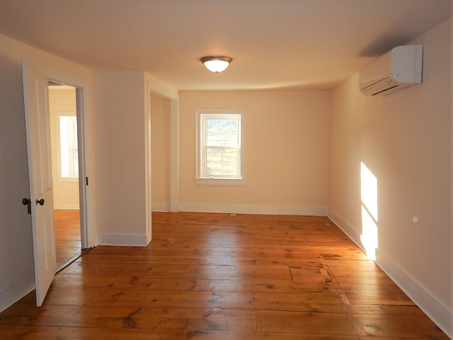 3653 Middlebrook Village Road Middlebrook, VA 24459 - Photo 28 of 48 an empty room with wooden floor and windows