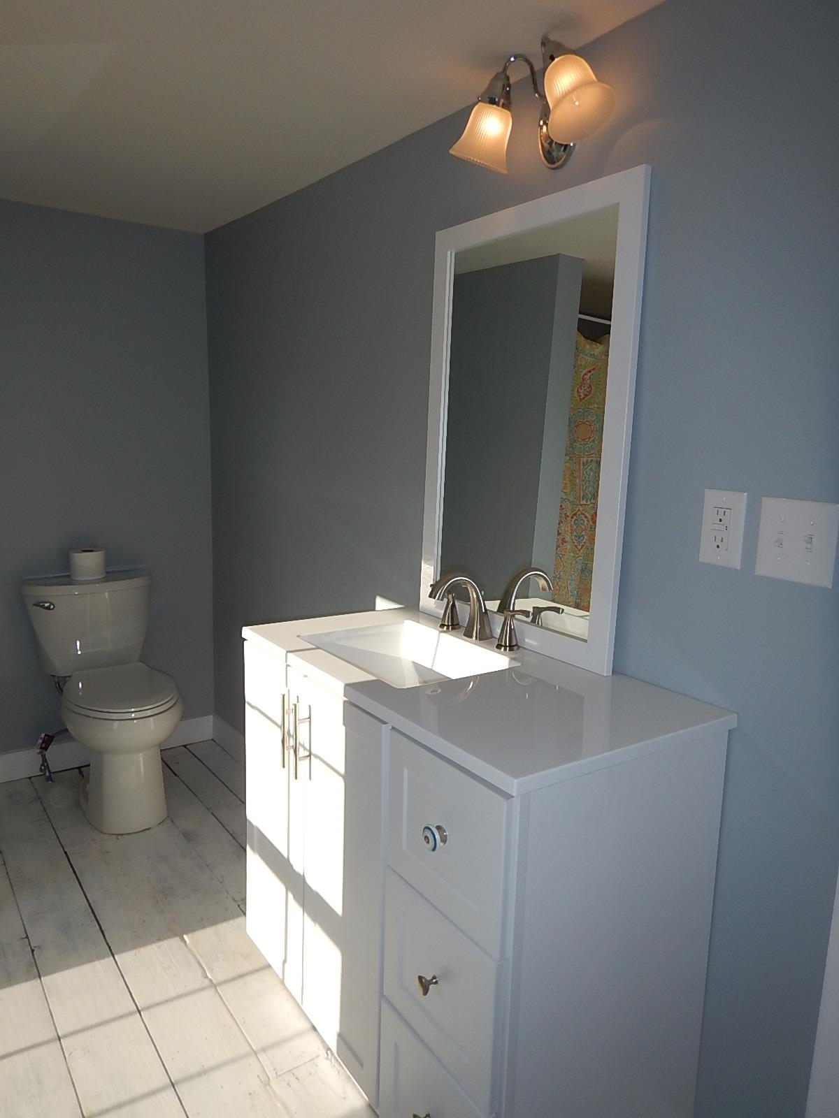 3653 Middlebrook Village Road Middlebrook, VA 24459 - Photo 34 of 48 a bathroom with a toilet sink and mirror