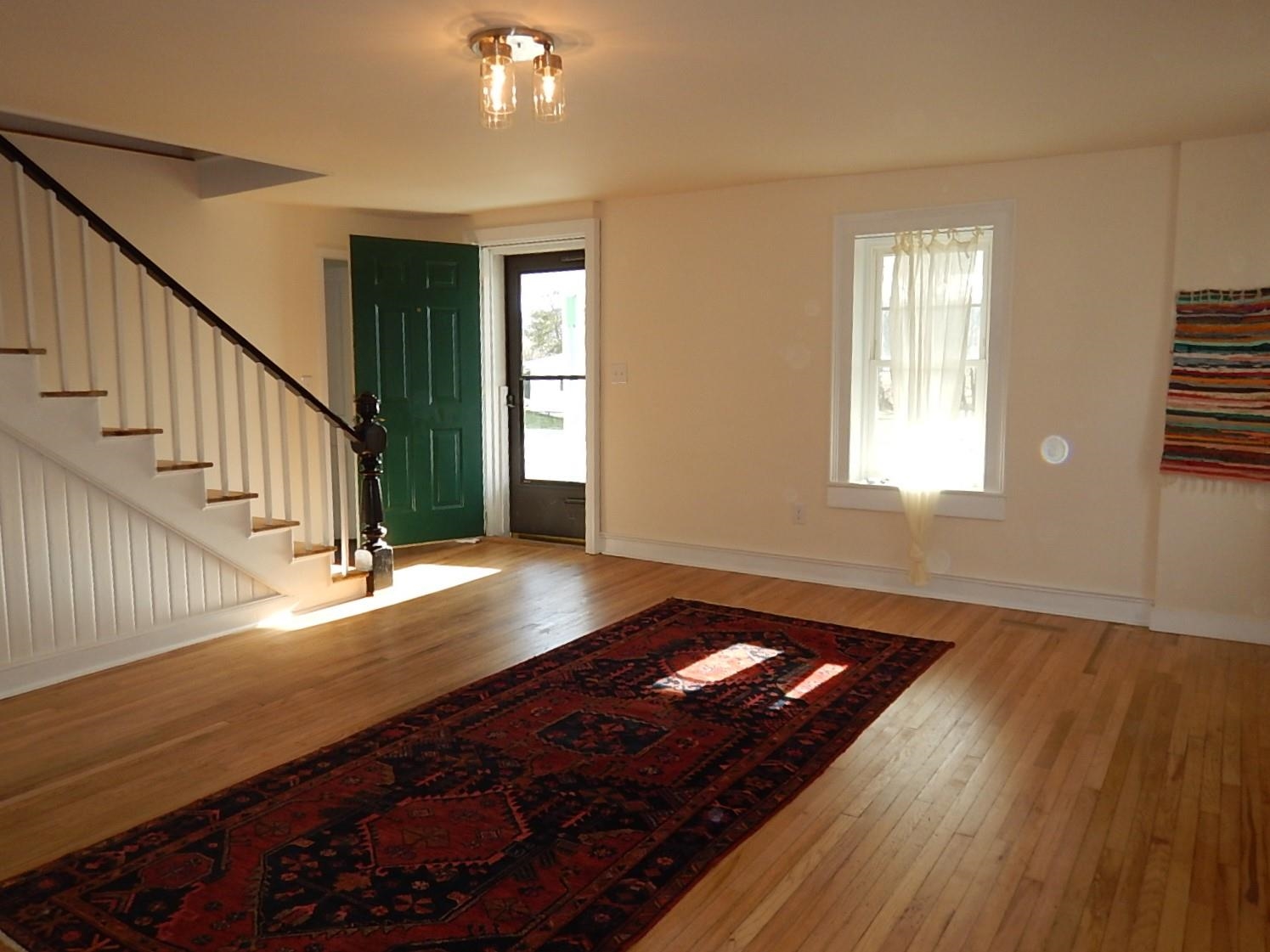 3653 Middlebrook Village Road Middlebrook, VA 24459 - Photo 5 of 48 a view of an empty room with wooden floor and a window