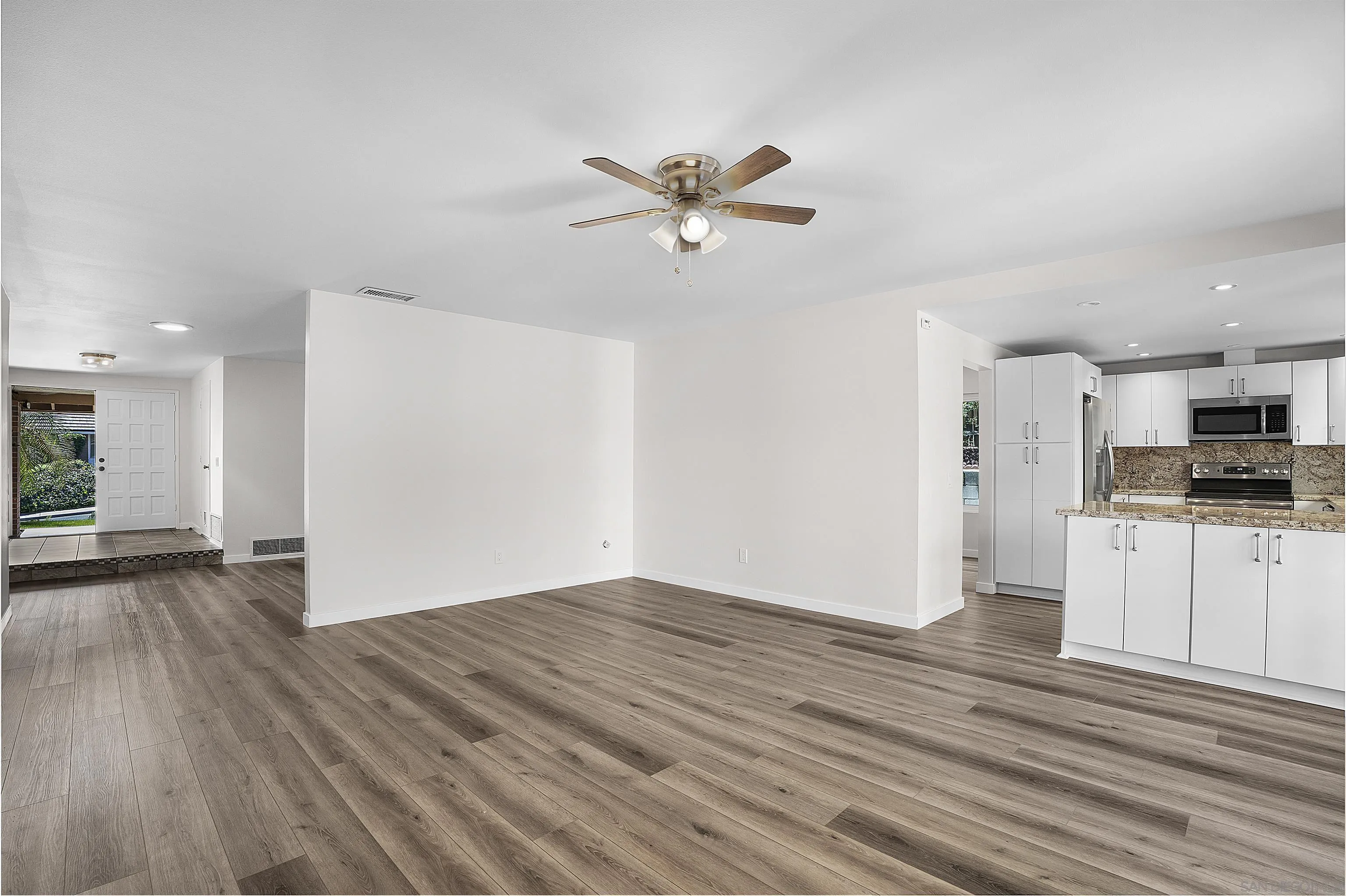 1454 Bathurst Place El Cajon, CA 92020 - Photo 12 of 35 a view of a kitchen with a sink and a refrigerator