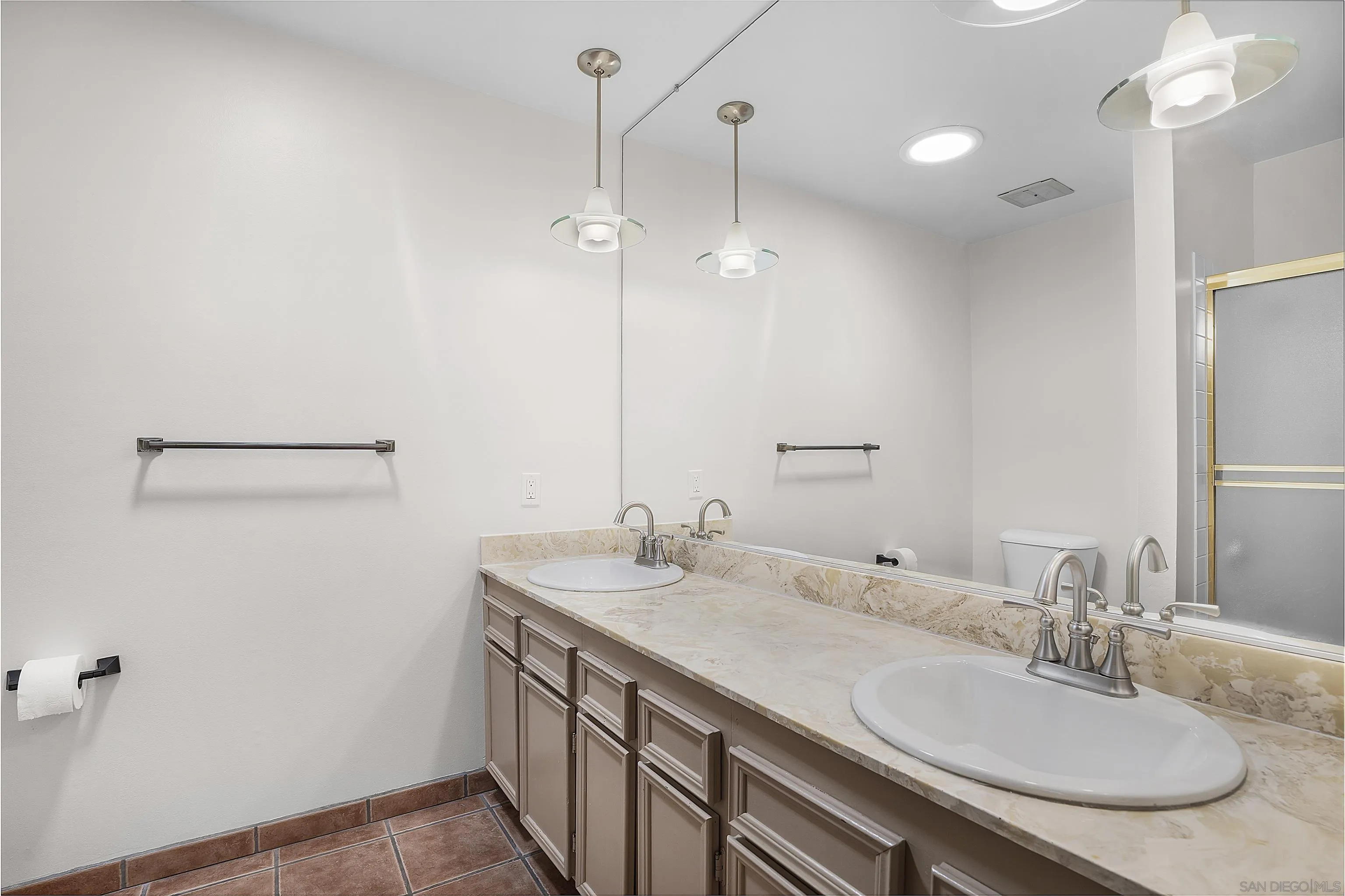 1454 Bathurst Place El Cajon, CA 92020 - Photo 17 of 35 a bathroom with a granite countertop sink a mirror and a shower