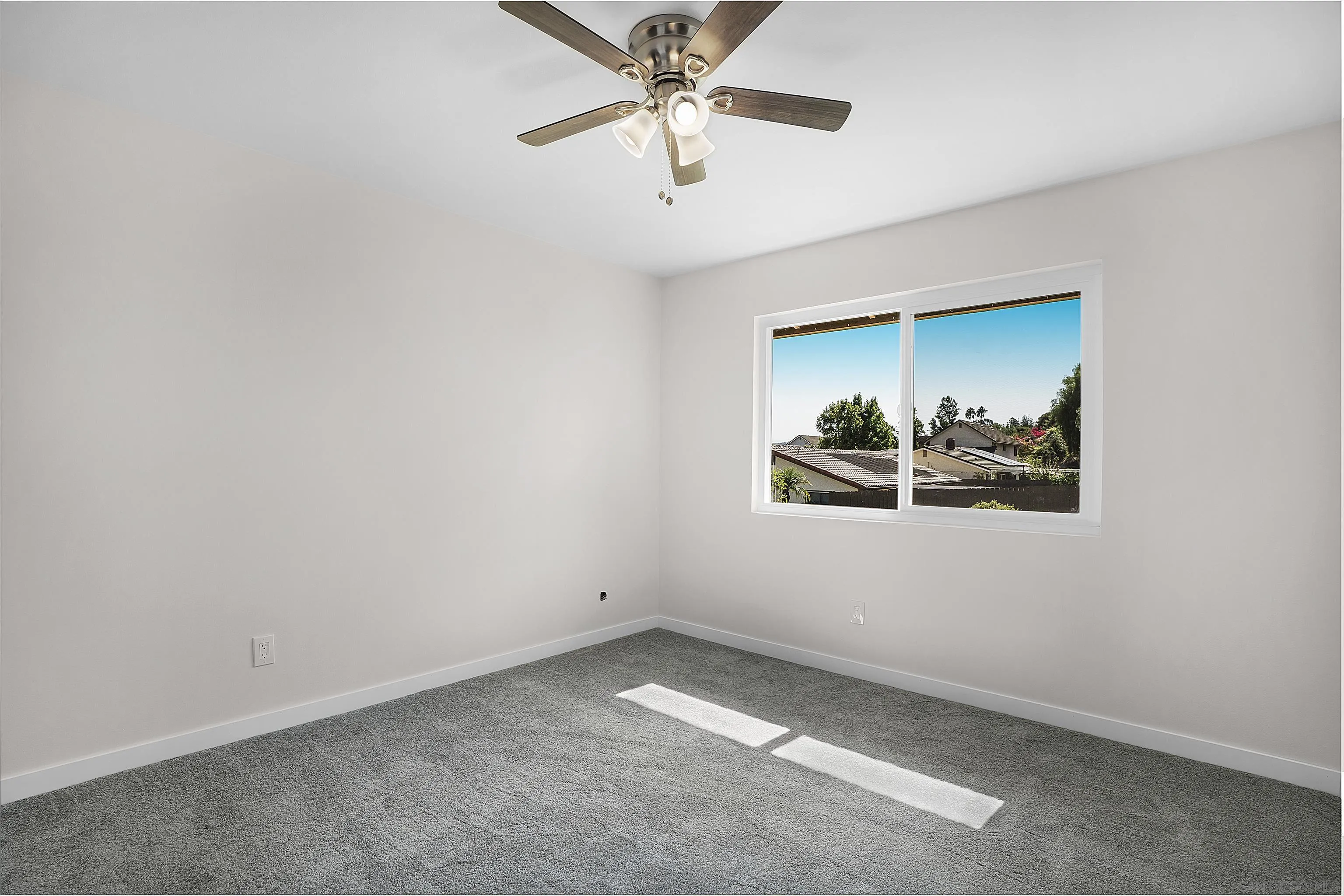 1454 Bathurst Place El Cajon, CA 92020 - Photo 19 of 35 an empty room with a window and a ceiling fan