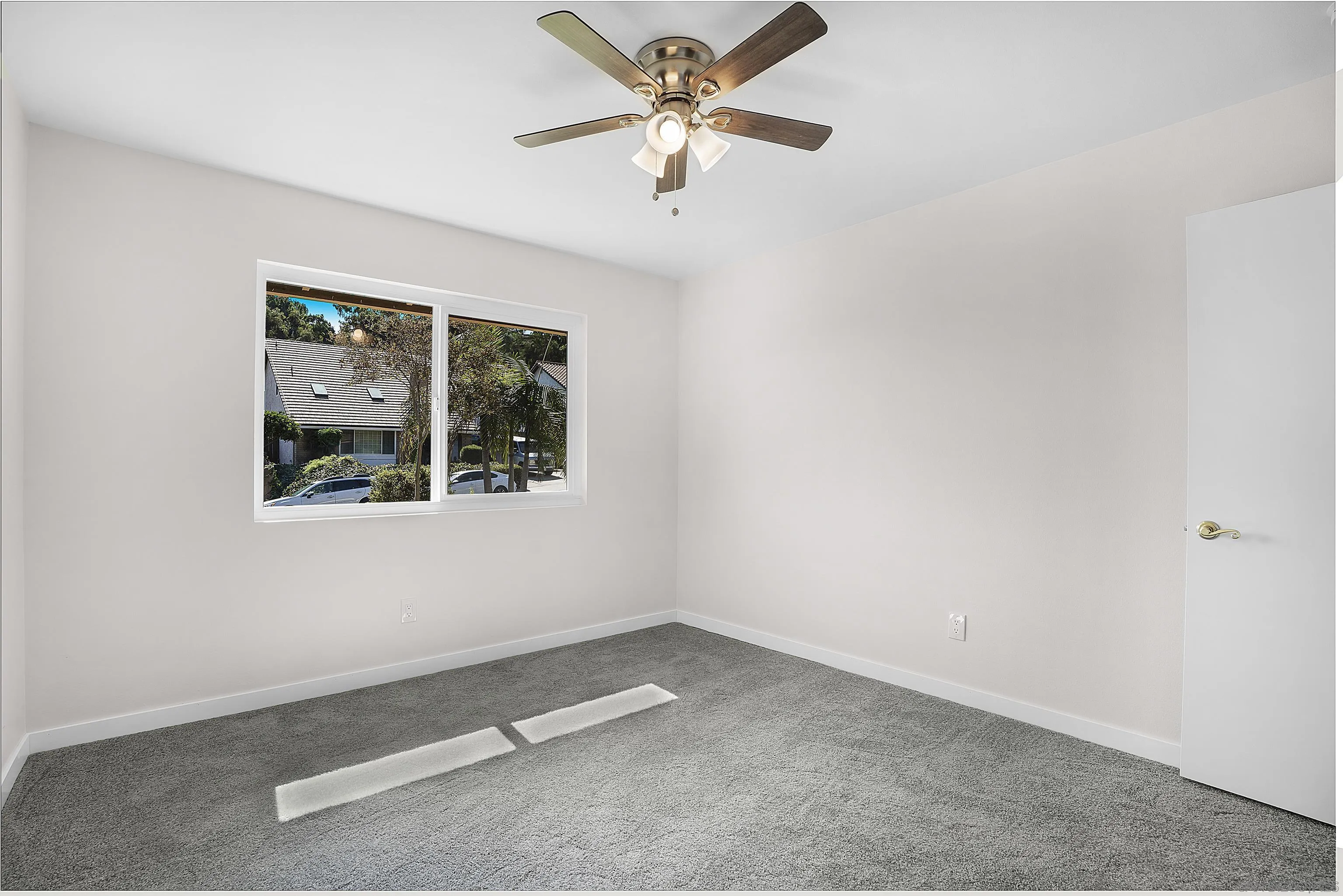 1454 Bathurst Place El Cajon, CA 92020 - Photo 20 of 35 an empty room with a window and a fan