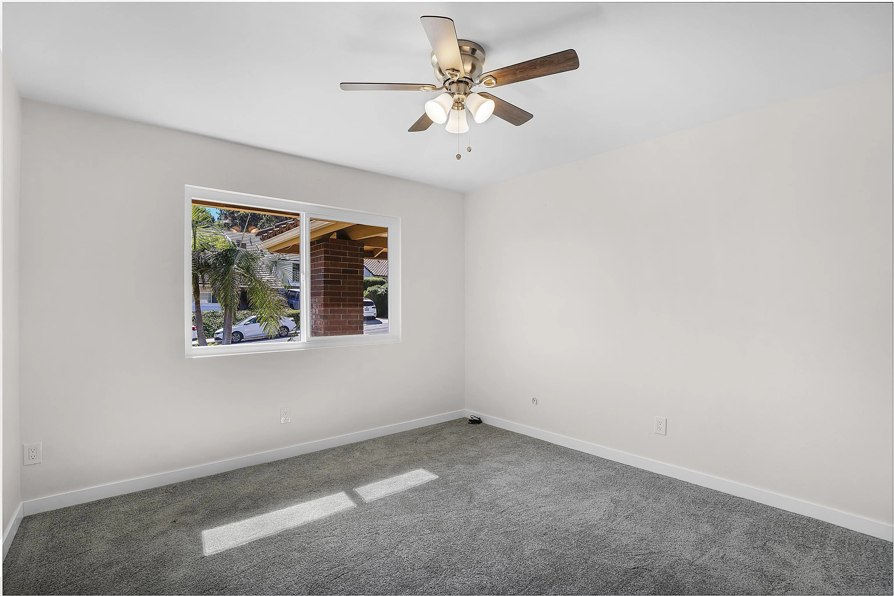 1454 Bathurst Place El Cajon, CA 92020 - Photo 21 of 35 an empty room with a window and a ceiling fan