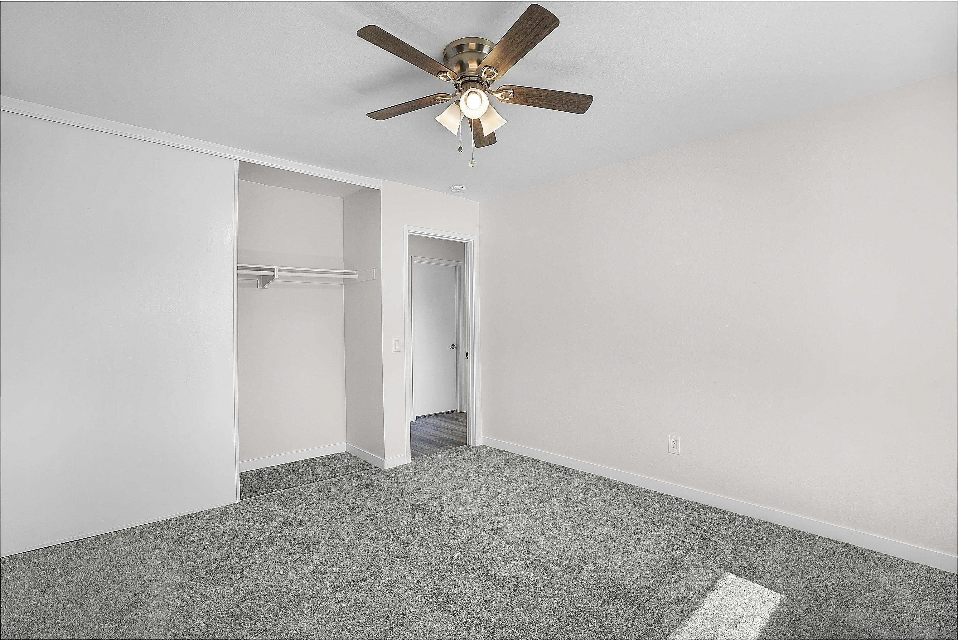 1454 Bathurst Place El Cajon, CA 92020 - Photo 22 of 35 an empty room with closet and a ceiling fan