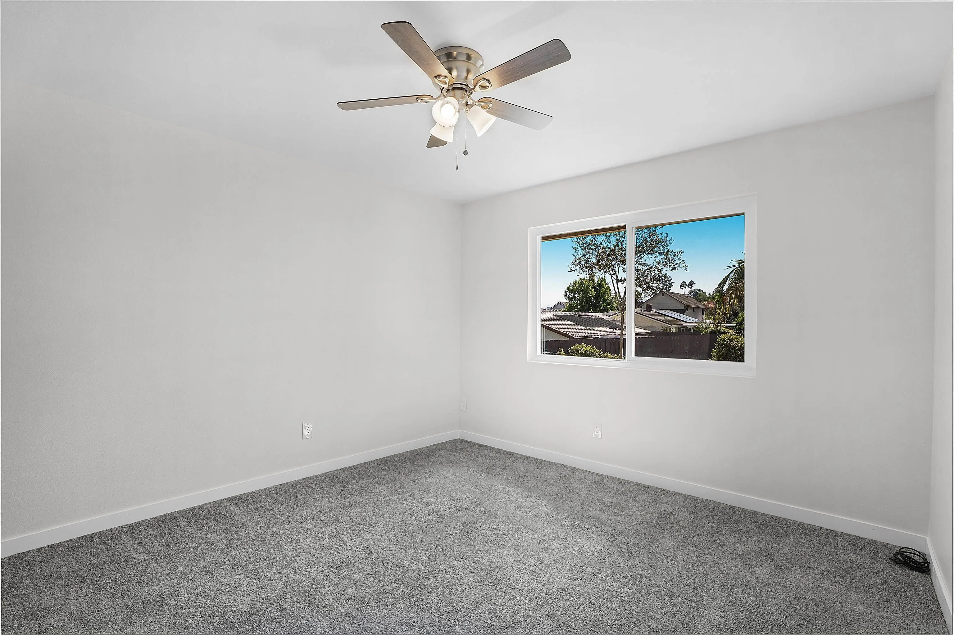 1454 Bathurst Place El Cajon, CA 92020 - Photo 23 of 35 an empty room with windows and ceiling fan
