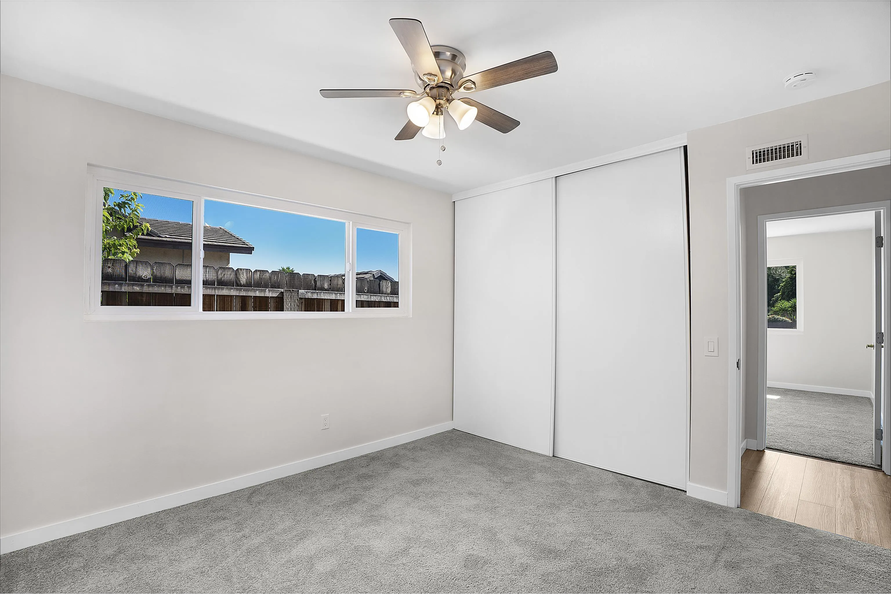 1454 Bathurst Place El Cajon, CA 92020 - Photo 25 of 35 wooden floor in an empty room with a window