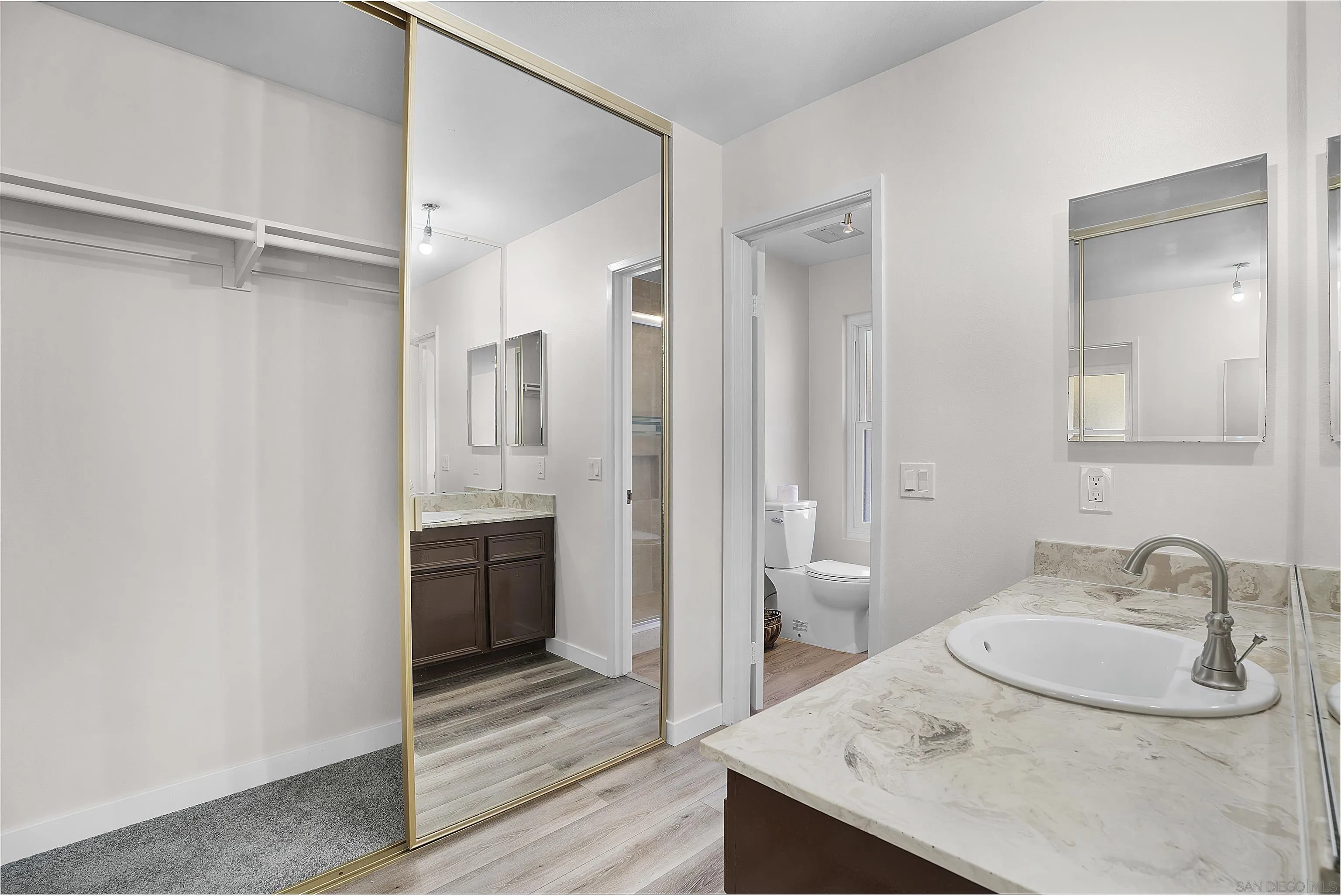 1454 Bathurst Place El Cajon, CA 92020 - Photo 29 of 35 a bathroom with a sink and a mirror