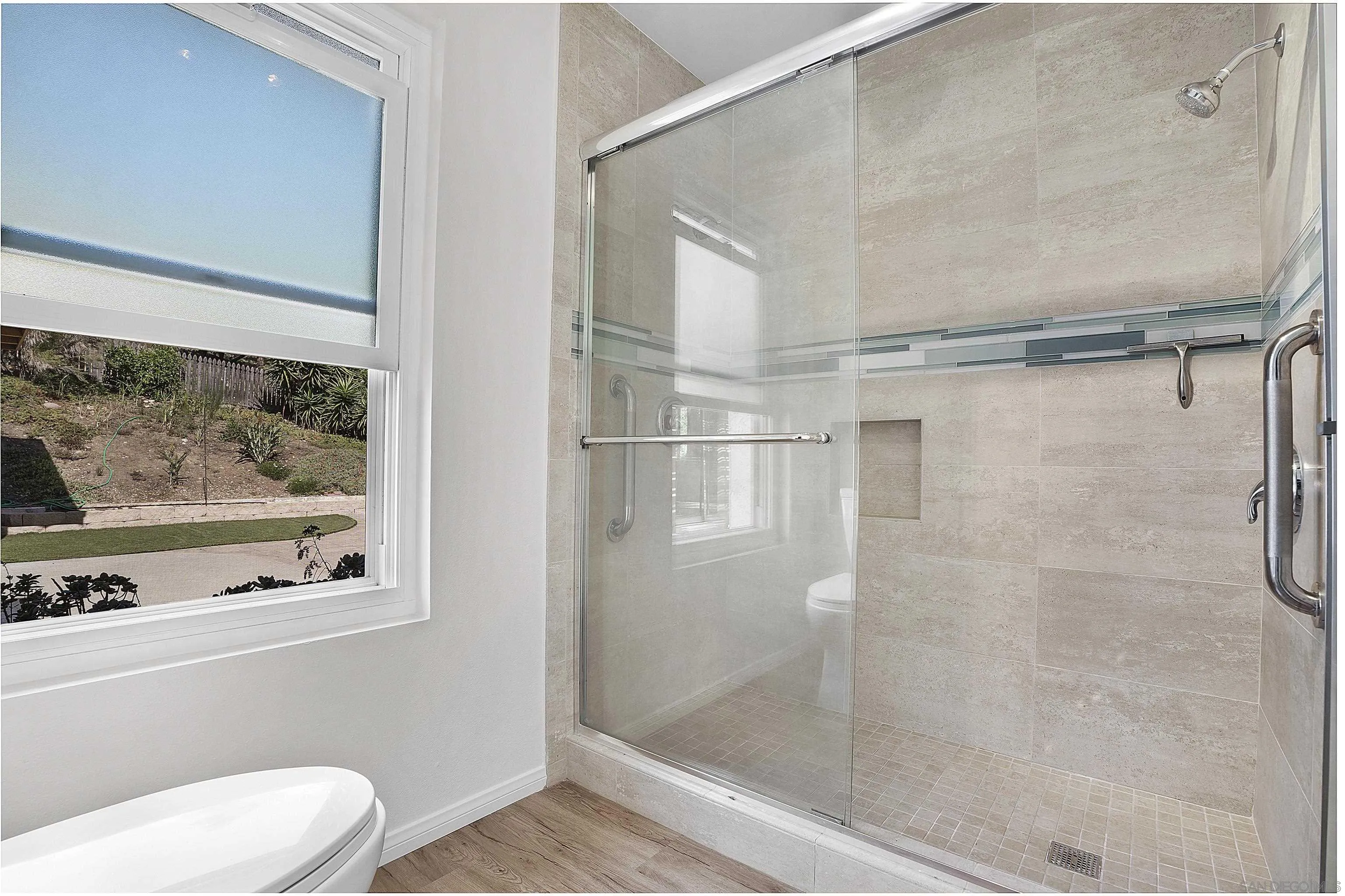 1454 Bathurst Place El Cajon, CA 92020 - Photo 30 of 35 a bathroom with a shower and toilet