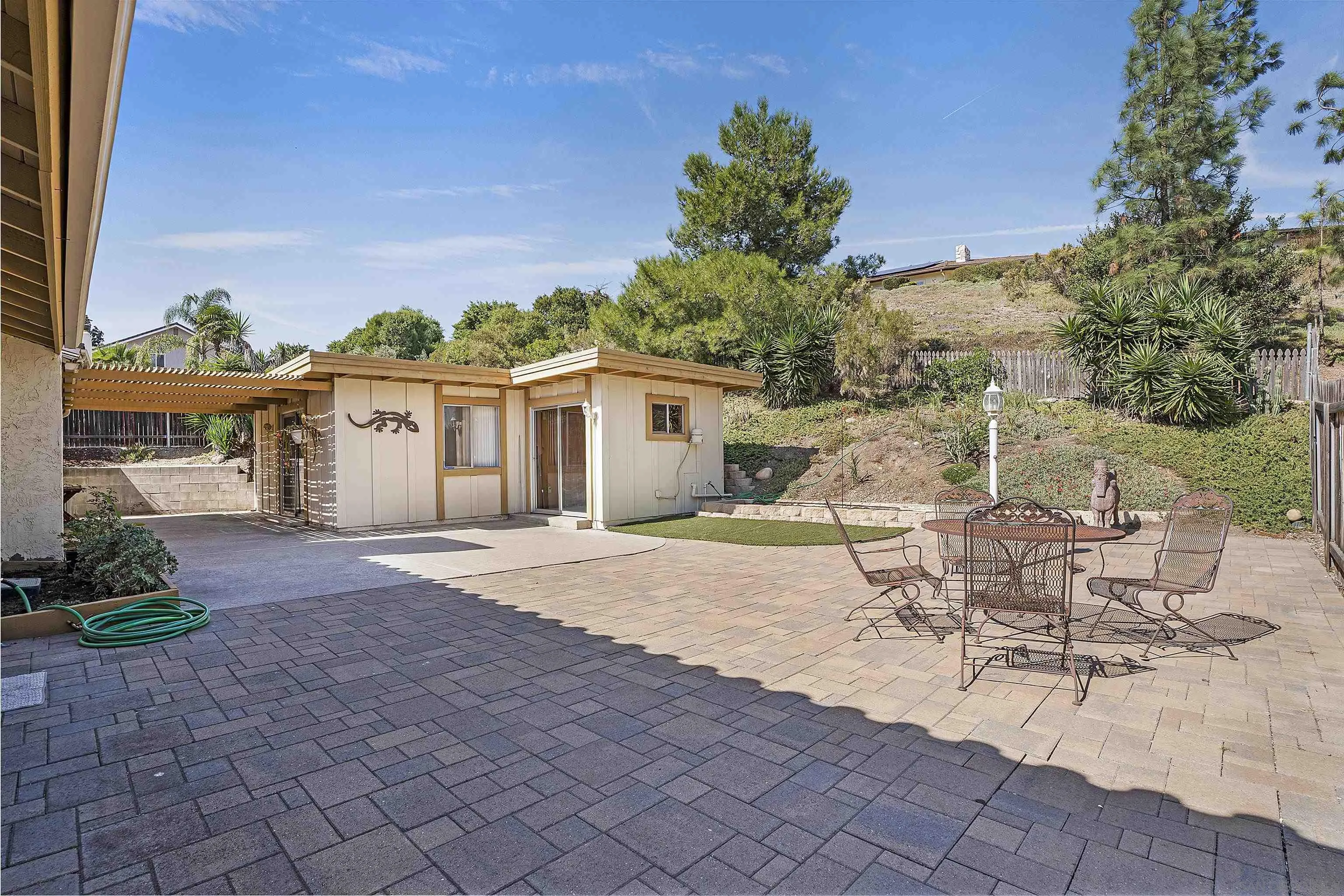 1454 Bathurst Place El Cajon, CA 92020 - Photo 34 of 35 a view of a patio with a table and chairs under an umbrella