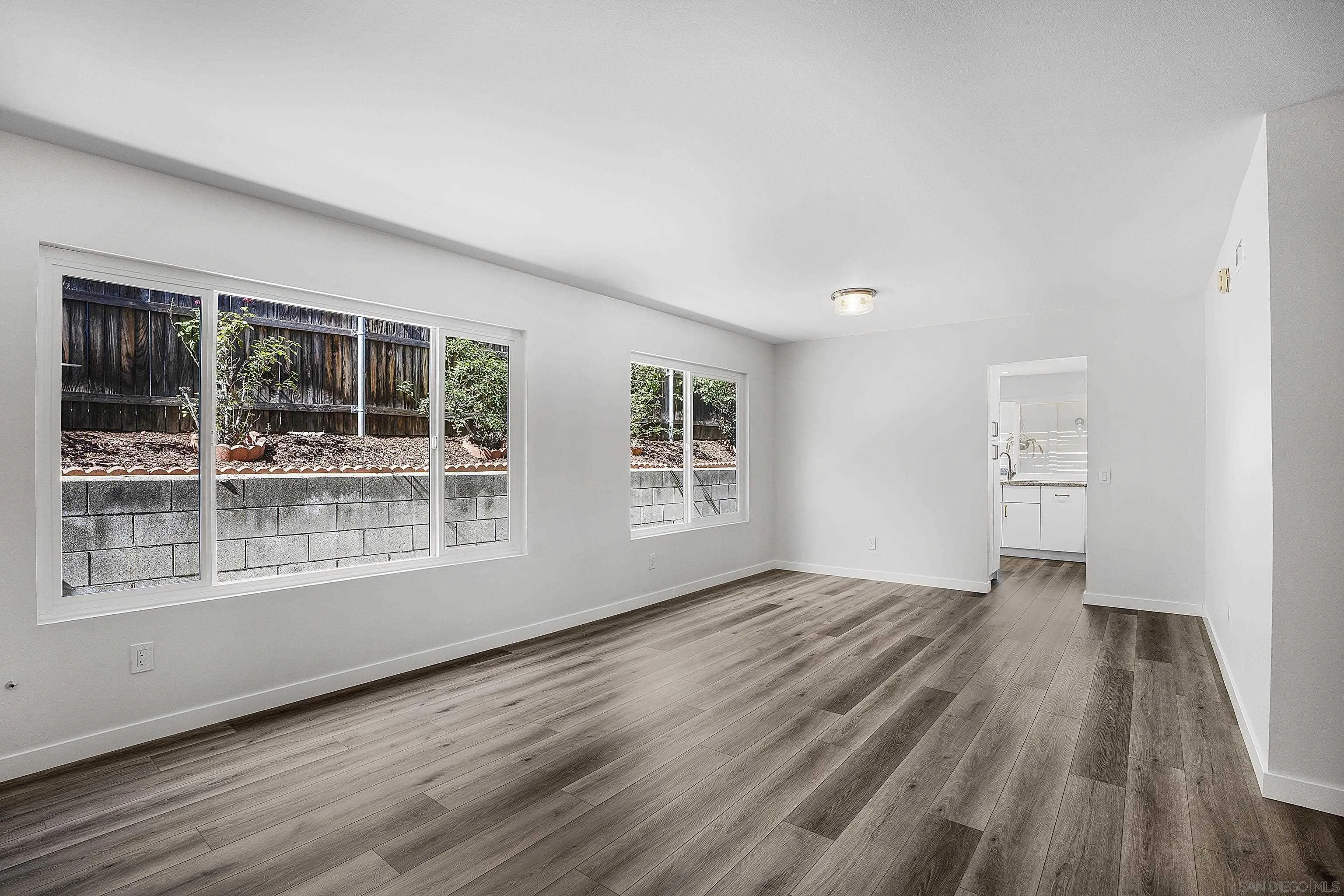 1454 Bathurst Place El Cajon, CA 92020 - Photo 10 of 35 a view of empty room with wooden floor and fan