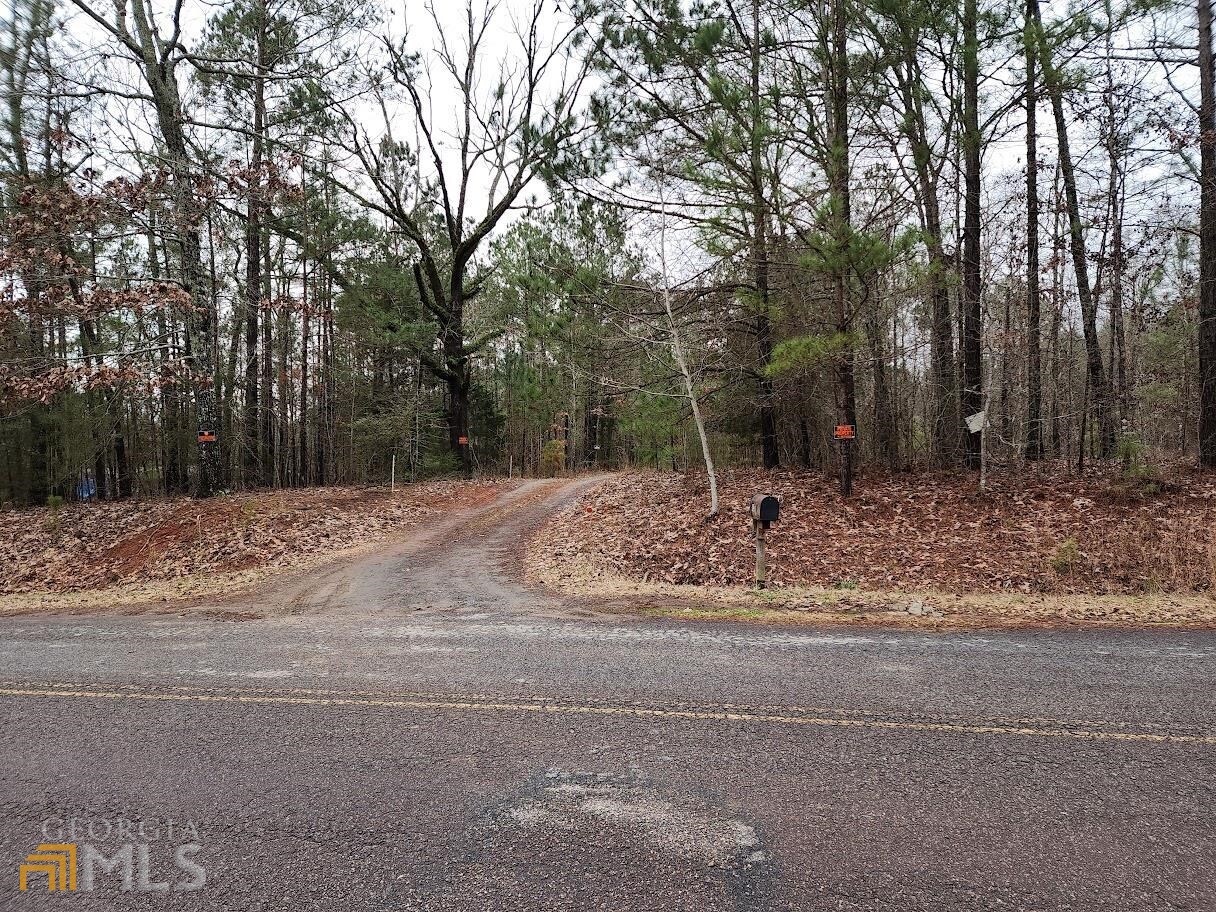 803 Old Indian Springs Road Forsyth, GA 31029 - Photo 1 of 1 a backyard of a house with trees