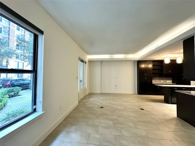 a view of kitchen with furniture and large window