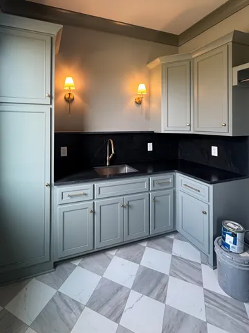 a kitchen with a sink and cabinets