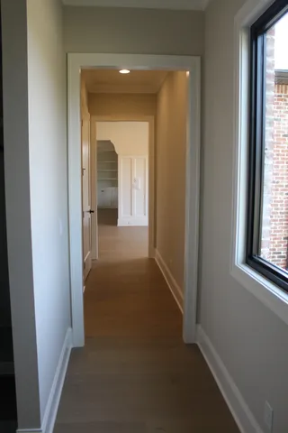 a view of a hallway with a window