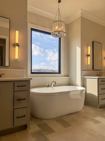 a bath tub sitting next to a bathroom sink