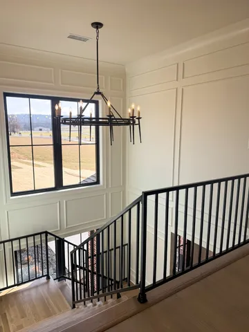 a view of a hallway with windows