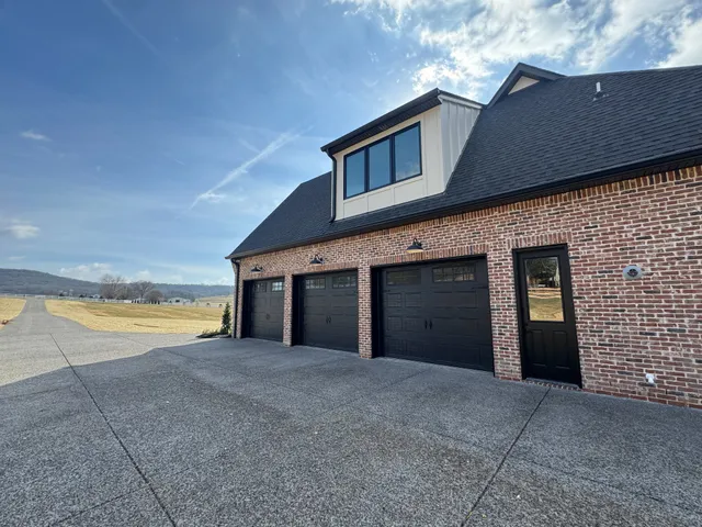 a view of a house with an outdoor space and seating area