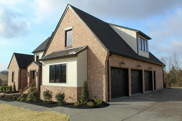 a front view of a house with garage