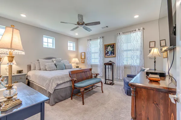 a bedroom with bed and a window