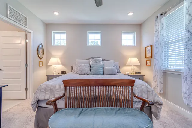 a bedroom with furniture and a window