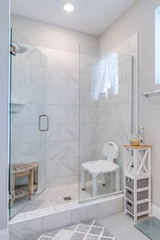 a bathroom with a window and a table