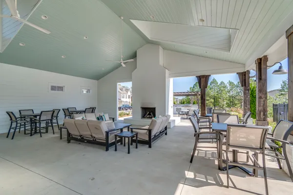a view of a patio with a table and chairs