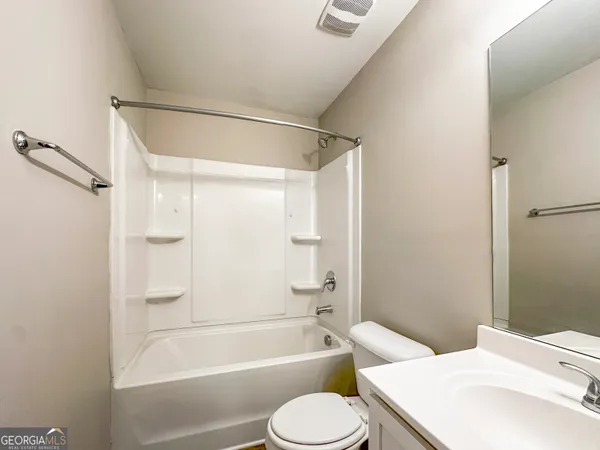 a bathroom with a sink toilet and bathtub