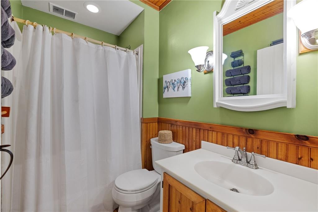 2240 County Line Road Champion, PA 15622 - Photo 22 of 45 a bathroom with a sink and a mirror