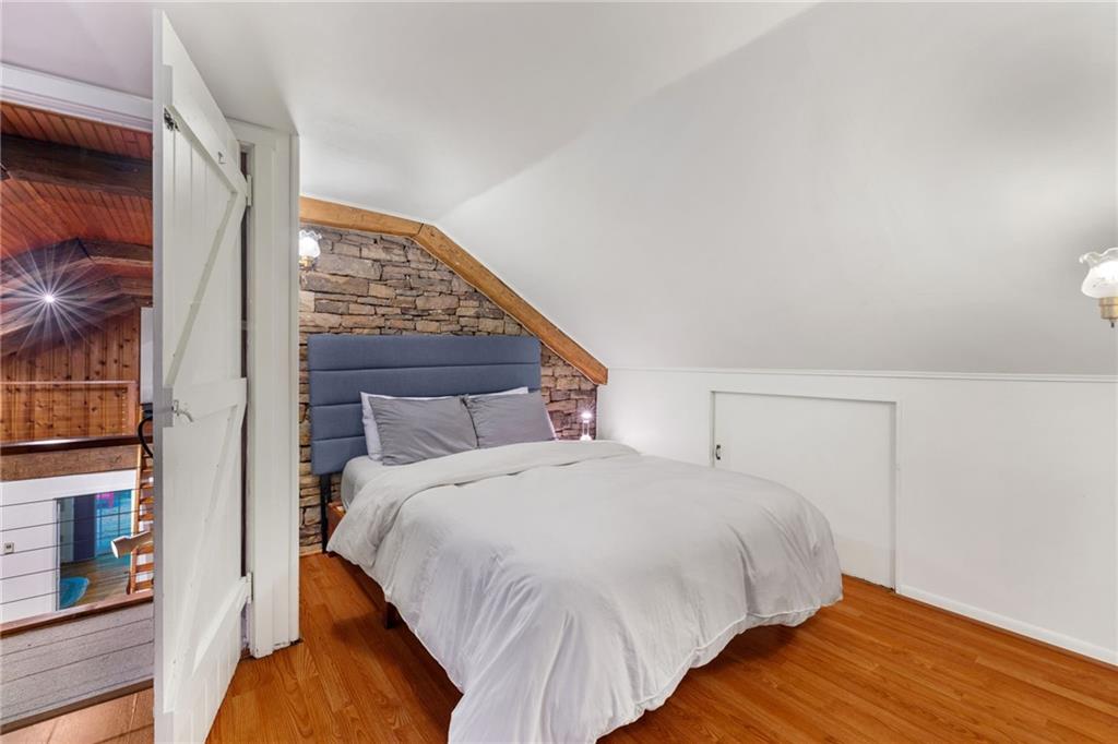 2240 County Line Road Champion, PA 15622 - Photo 26 of 45 a large bed sitting in a bedroom next to a window