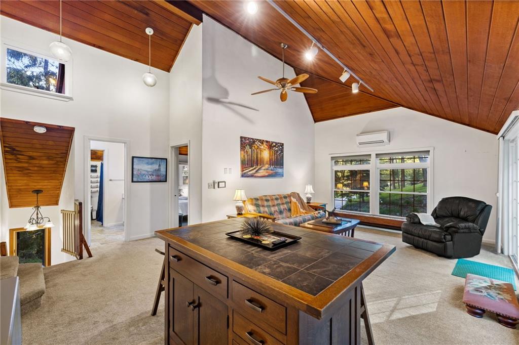 2240 County Line Road Champion, PA 15622 - Photo 29 of 45 a living room with furniture a flat screen tv and a large window