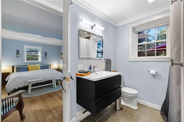 a backyard of a house with barbeque oven table and chairs