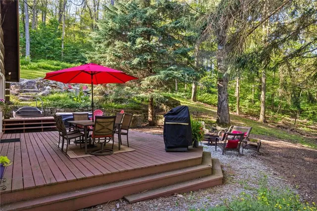 an outdoor sitting area with chairs and table