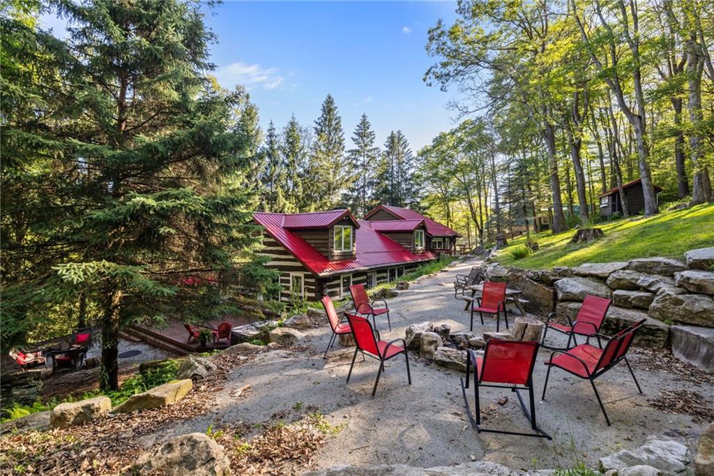 2240 County Line Road Champion, PA 15622 - Photo 42 of 45 an outdoor sitting area with chairs and table