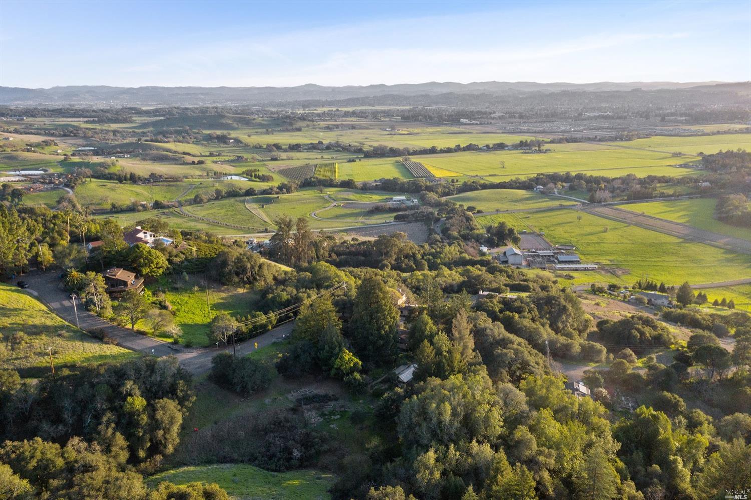 5577 Inverness Avenue Santa Rosa, CA 95404 - Photo 1 of 1 Enjoy life to the fullest in your idyllic oasis above the fog. Meandering paths connect your home, gardens, green house, winter creek, redwood grove and more. Quiet enjoyment of beautiful views wait for you at 5577 and 5561 Inverness Avenue. This single-level home has been lovingly maintained, with French drains, solar array (approx 3.5kW), “Life Source” water treatment system for the mutual water system, newer HVAC with furnace, heat pump & ducting installed in 2018, dual pane windows throughout, main house electrical panel replaced in 2005 & outside auxiliary in 2018, “Juice Box” Level II electrical vehicle charger, new driveway installed in 2016 with gated “Mighty Mule” automatic opener, kitchen floor tiled in 2019, sewage piping replaced in 2013, main roof replaced in 2002 w/ sunroom roof replaced in 2016.
