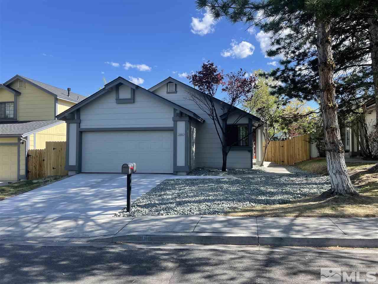 5880 Coyote Ridge Road Reno, NV 89523 - Photo 1 of 28 a view of a house with a yard