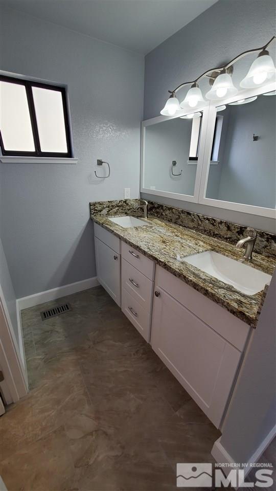 5880 Coyote Ridge Road Reno, NV 89523 - Photo 22 of 28 a bathroom with a sink and a mirror