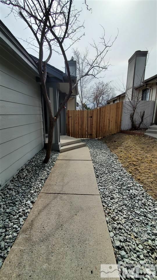 5880 Coyote Ridge Road Reno, NV 89523 - Photo 4 of 28 a view of a backyard with wooden fence