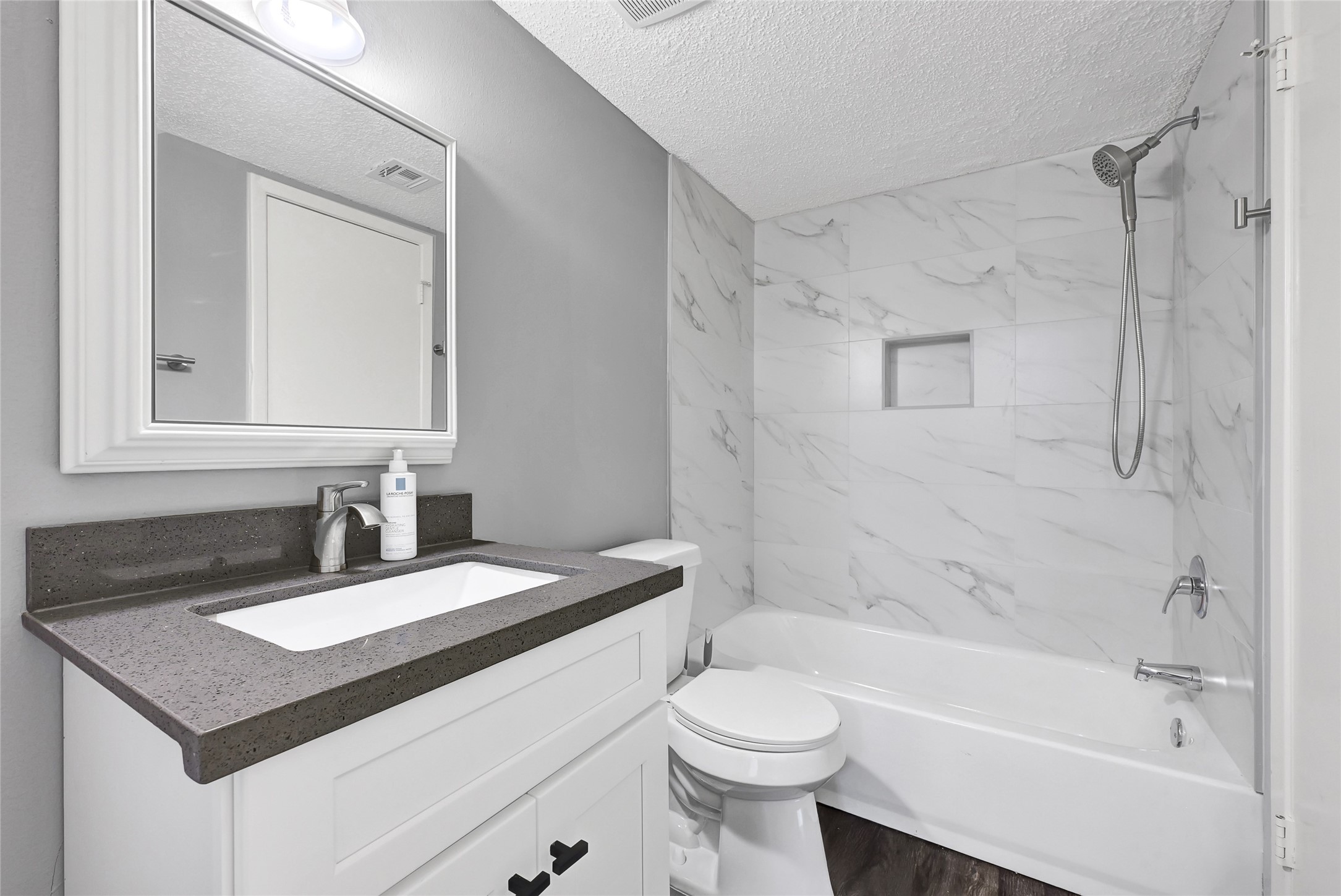 12111 Lemon Ridge Lane, Unit 121 Houston, TX 77035 - Photo 15 of 25 a bathroom with a sink vanity granite toilet tub and shower