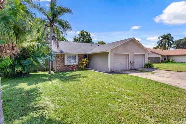 a view of a house with a yard