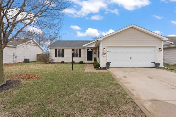 a view of a house with a yard