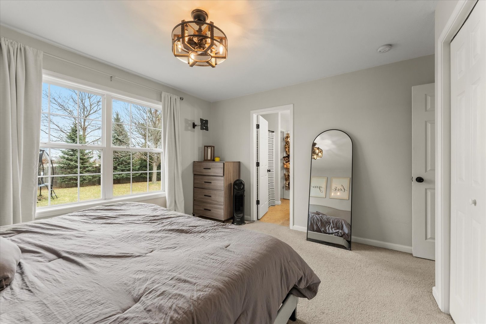 706 Northgate Drive St. Joseph, IL 61873 - Photo 17 of 33 a bed sitting in a spacious bedroom next to a window