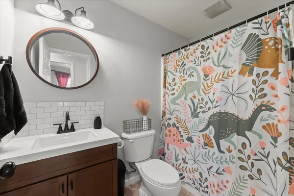a bathroom with a toilet and a sink