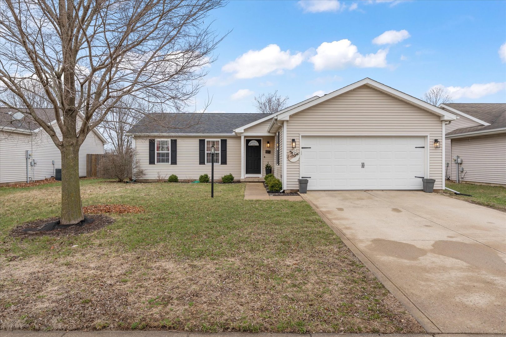 706 Northgate Drive St. Joseph, IL 61873 - Photo 31 of 33 a view of a house with a yard and tree