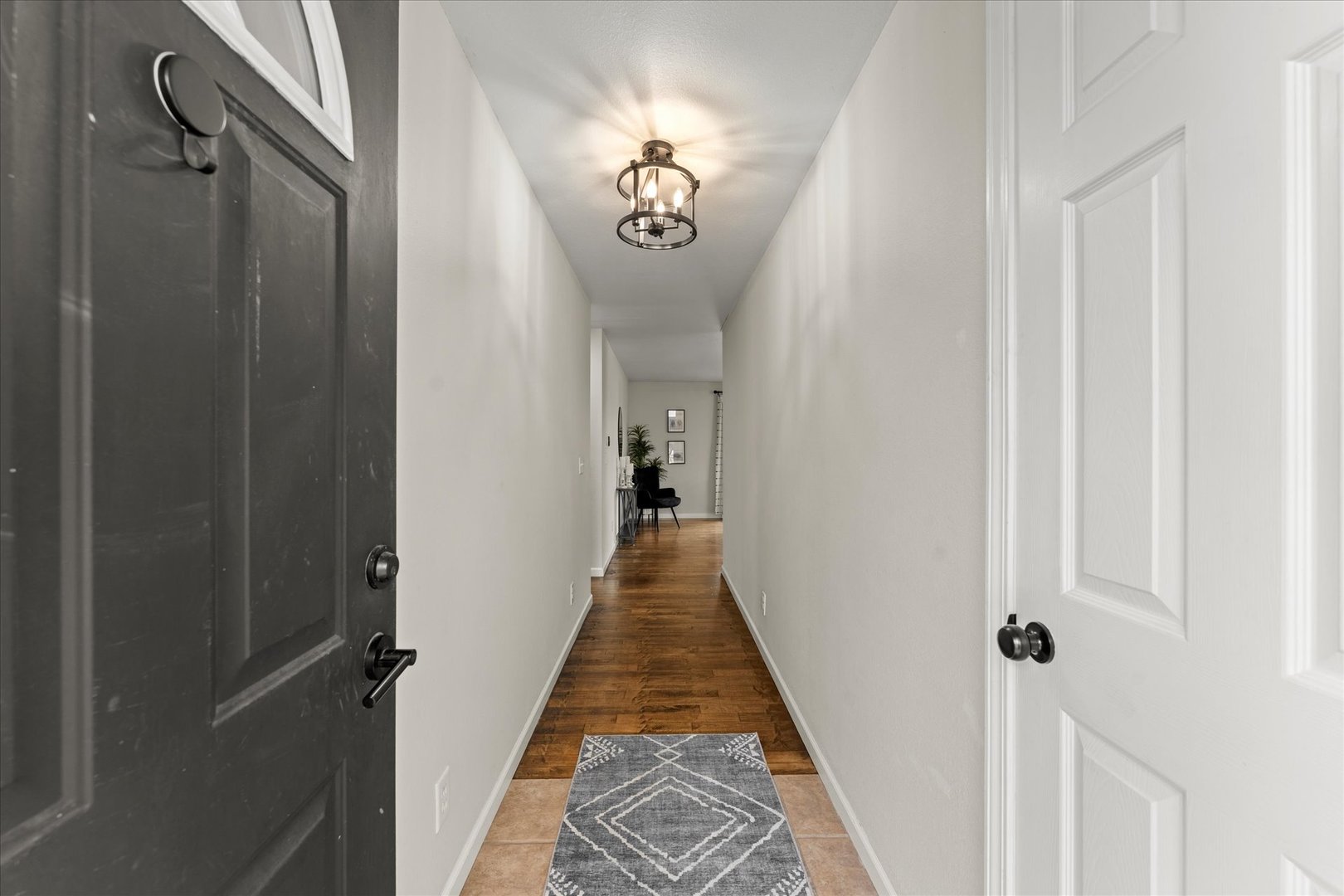 706 Northgate Drive St. Joseph, IL 61873 - Photo 5 of 33 a view of a hallway with wooden floor and staircase