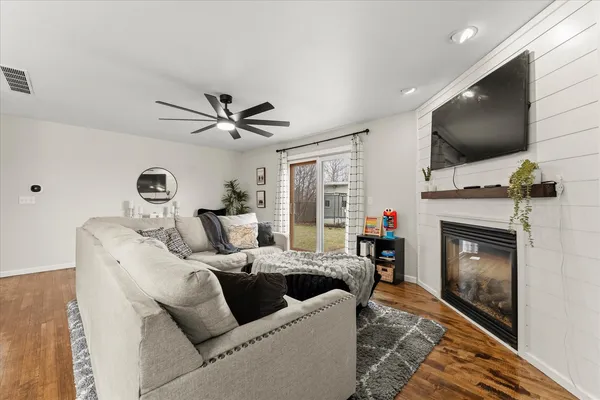 a living room with furniture and a fireplace