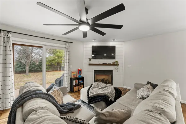 a bedroom with a bed and a fireplace