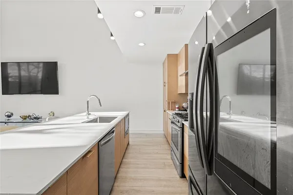 a bathroom with a double vanity sink and a mirror
